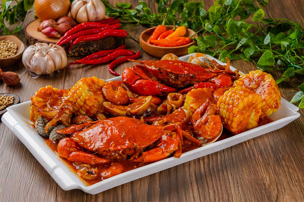 Golden baked Crab Imperial in a ramekin with a garnish of lemon and parsley