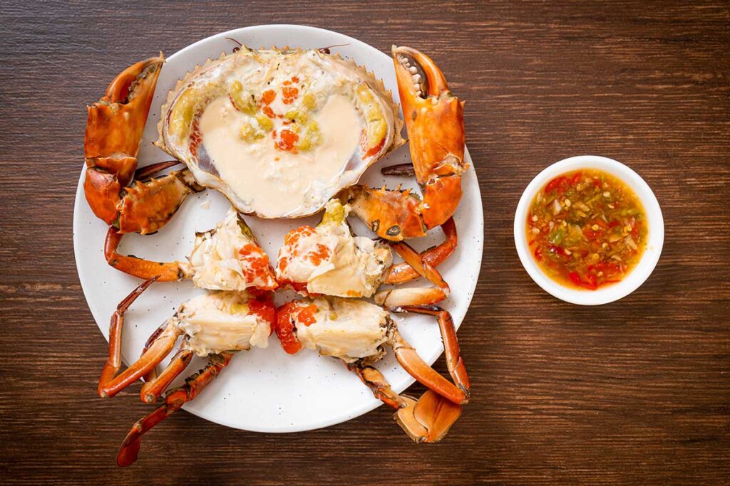 A plate of golden deviled crab and creamy crab imperial side by side