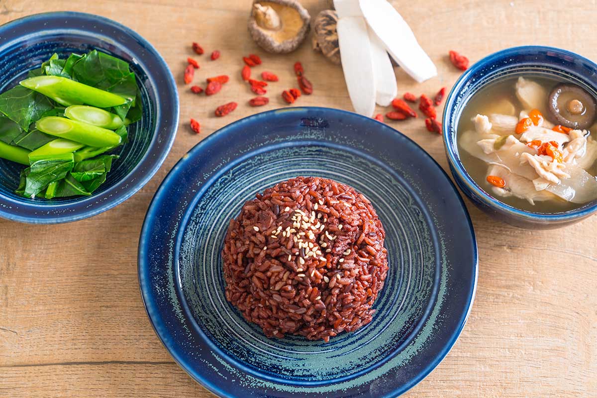 Bowl of soaked red rice ready for cooking