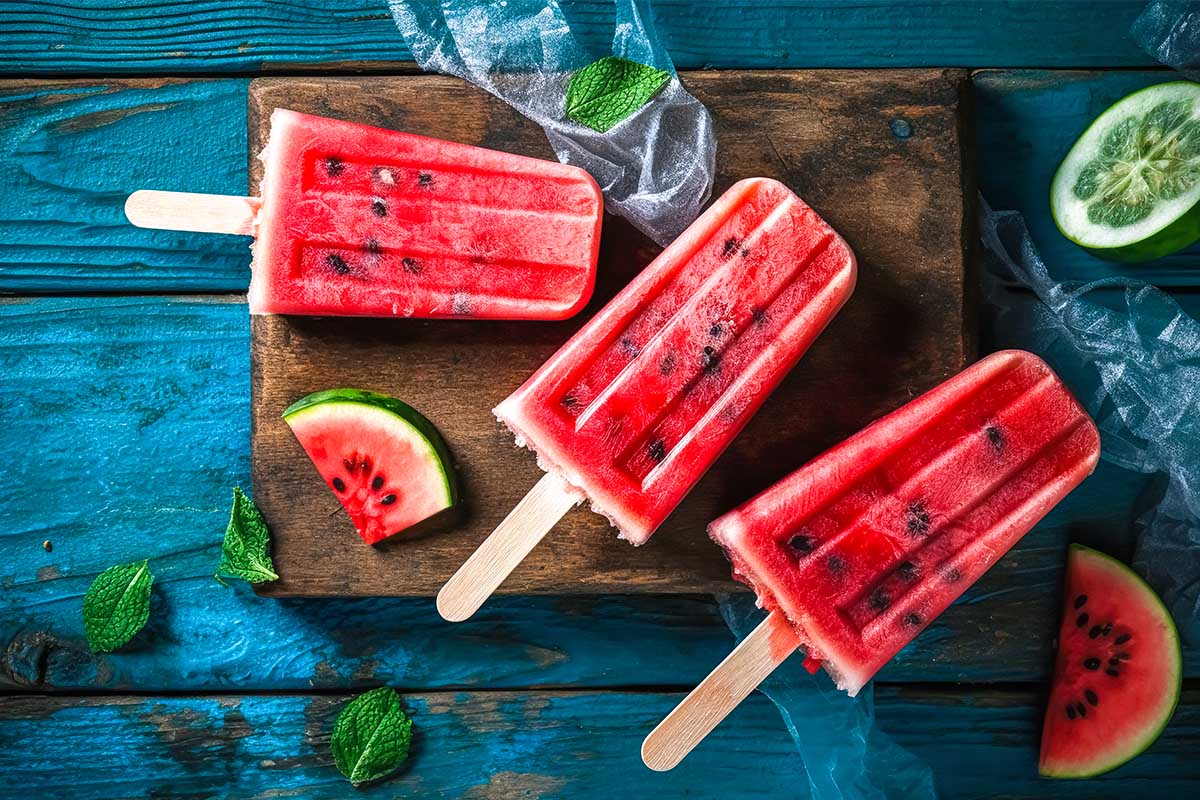 Watermelon popsicles arranged neatly with no separation in layers